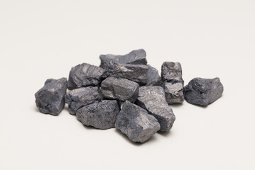 Obraz premium Spheroidizing Agent (Nodulizer) for Cast Iron, Metallic Alloy Lumps on White