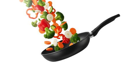 A black frying pan with colorful vegetables flying out of it on transparent background