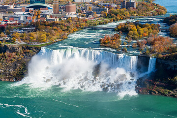 Niagara River American Falls in autumn foliage season. Niagara Falls City, Ontario, Canada.