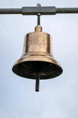 Hanging brass bell for religious purposes