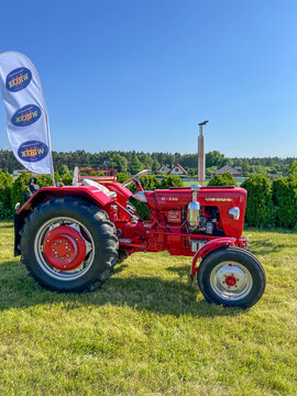 Dyrdy, Poland, June 14, 2025: An old, renovated Polish Ursus C 330 tractor from 1968 stands in a meadow
