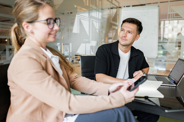 Business meeting with two professionals at a table