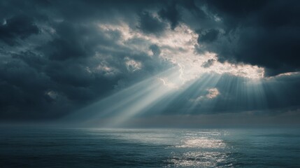 ocean with clouds and sunbeams through the clouds
