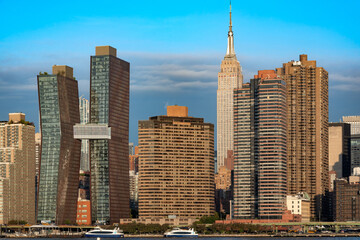 The impressive Midtown Manhattan skyline viewed across the East River from the waterfront at Hunters Point South Park in Long Island City.