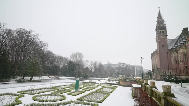 The frozen garden of the Peace Palace under a fallen snow