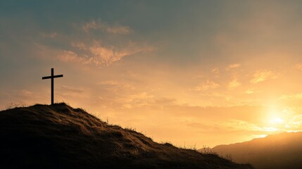 CROSS ON A HILL AT SUNSET