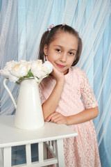 Beautiful Little Girl in Pink Dress with White Flowers in Dreamy Blue Setting