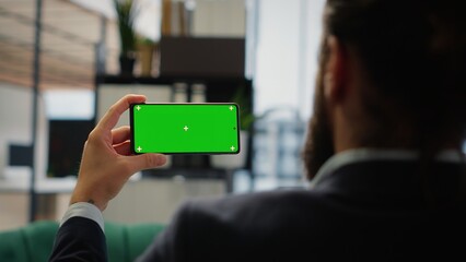 Smart businessman in office makes business projections next to copy space, reviews profitability reports and executes investment strategies for sustained corporate growth. Success story. Camera B.