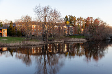 Houses near river in Perth, Ontario, Canada. Spring waterfront landscape