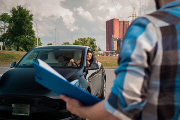 Smiling woman learning to drive and looking out the car window, looking at the instructor with test report. Driving test, driver courses, exam concept