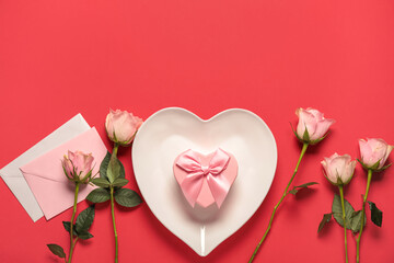 Beautiful table setting for Valentine's Day with rose flowers and envelopes on red background