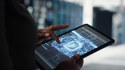Close up of data center technician doing AI data analysis on tablet to upgrade infrastructure. Server room employee using device to manage storage systems for machine learning training datasets