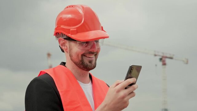 Male with modern gadget at construction site