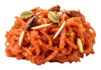 orange carrot halwa dessert with pistachios and almonds on white backdrop