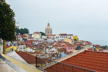 Colorful hillside view over historic Lisbon rooftops