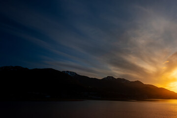 Sun sets over harbor at Juneau, Alaska