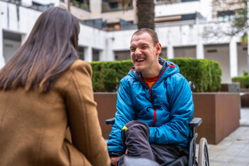 Happy man with disability enjoying outdoor conversation
