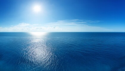 Obraz premium Blue Ocean Panorama With Sun Reflection The Vast Open Sea With Clear Sky Ripple Wave And Calm Sea With Beautiful Sunlight