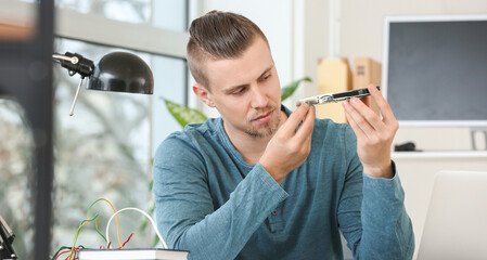 Electronic technician working in service center
