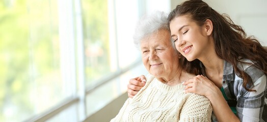 Senior woman with her granddaughter in nursing home