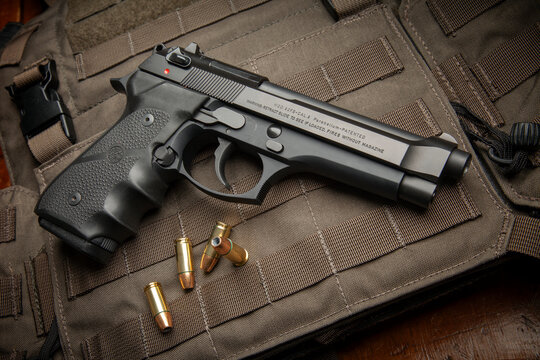 Beretta 92FS. 9mm semi-automatic handgun with custom wrap around Hogue grips. Federal 147 grain hollow point ammunition and London Bridge Trading plate carrier.