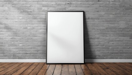 mockup of a blank vertical frame leaning slightly backward against a gray brick wall, placed on a wooden floor