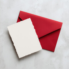 Elegant handmade deckle edge blank card with a red envelope, styled on a minimalist background