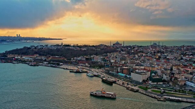 Drone footage showing Sarayburnu, Topkapi Palace, Hagia Sophia, the Blue Mosque and the Marmara Sea, all illuminated by dramatic sunset colors over Istanbul&rsquo;s historic peninsula.
