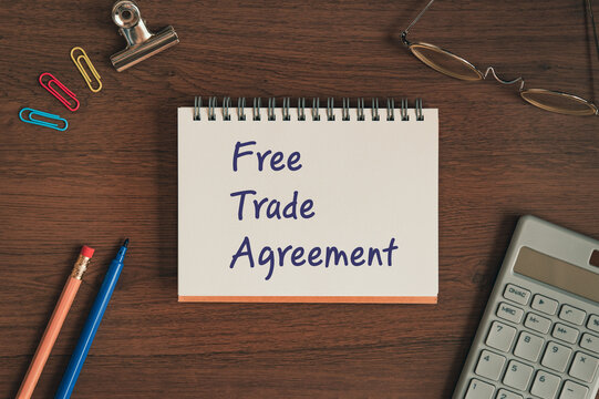 There is notebook with the word Free Trade Agreement. It is as an eye-catching image.