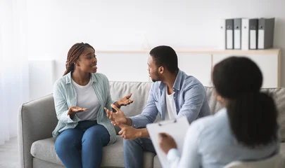 Fotobehang Muziek Young black couple having conflict during marital therapy with psychologist at office, panorama. Psychotherapist having consultation with African American spouses at clinic. Marriage problems concept  © Prostock-studio