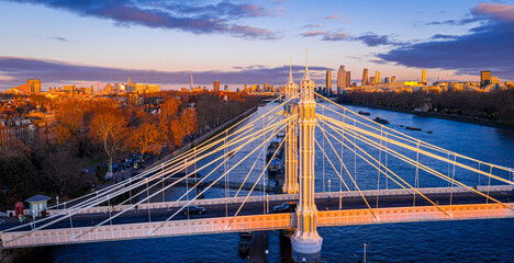 Albert Bridge panoramic view over River Thames at sunset, Chelsea London UK