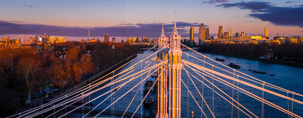 Albert Bridge panoramic view over River Thames at sunset, Chelsea London UK