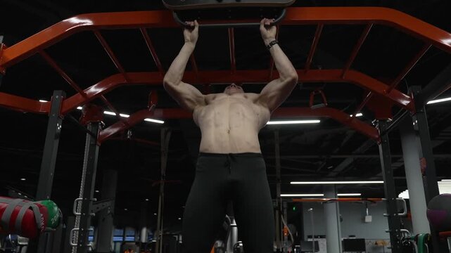 Muscular man sportsman with strong torso muscle. Sport pullup workout. Sport training. Man sportsman do pullup exercise. Muscular biceps and triceps. Strong athlete. Man pullup at gym