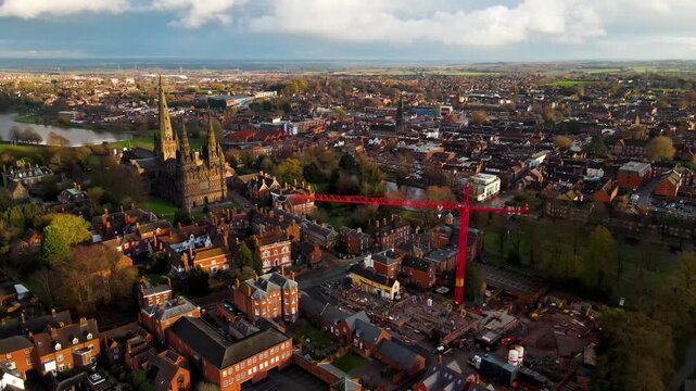 Aerial panorama of Lichfield town with cathedral spires and crane
