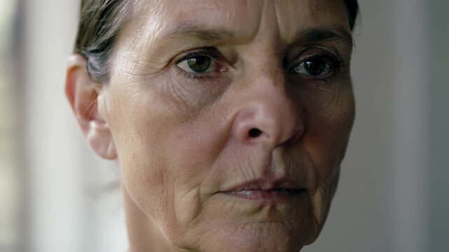 Thoughtful Expression: A close-up portrait of a woman, radiating a spectrum of emotions from deep reflection to serene calm.