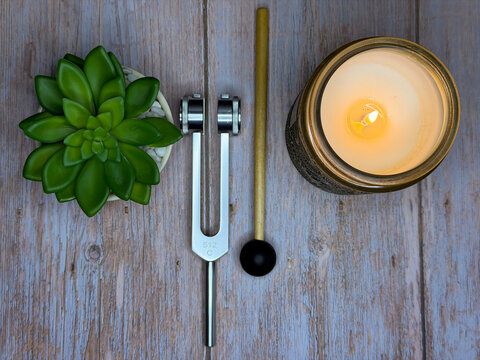 Mindfulness and Meditation Self Care Flat Lay With Candle, Tuning Fork, and Succulent Plant
