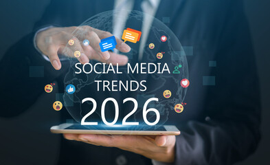 Hand touching smartphone with social media trends 2026 interface, digital marketing strategy concept, future communication, global network, online technology, viral content planning and engagement