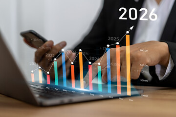 Businessman with digital arrow graph with 2026 year number, business growth, financial plan and strategy for new year 2026, marketing and profit, corporate future success and development concept