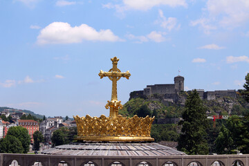 Close up of the Golden cross of the Basilica of Our Lady of Lourdes, taken in July 2024.