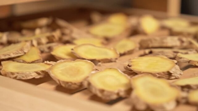 Close Up of Sliced Ginger on Wooden Rack Focus Shot Herb Spice Ingredient Cooking Flavor Asian Cuisine Healthy Natural