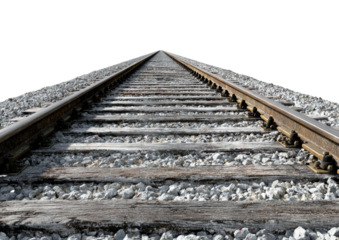 Rail tracks converge toward horizon on gravel