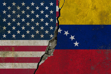 United States and Venezuela flags divided by crack symbolizing political tension