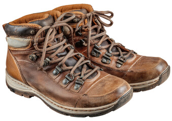 Well-worn leather hiking boots with laces and metal hardware, against a dark background