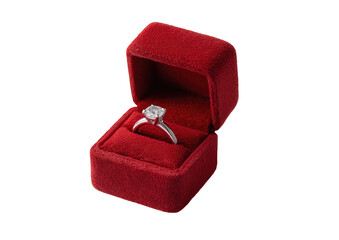 Diamond ring sparkles inside a plush, red velvet box, a symbol of love