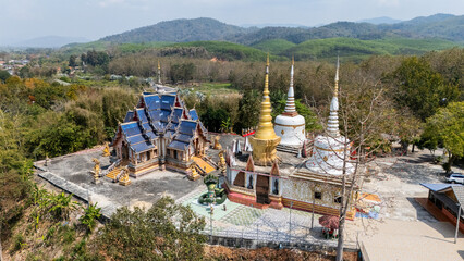 Aerial view of Wat Phrathat Hua Kwan temple the beautiful local temple situated nearly Mekong river in Chiang Saen district in Chiang Rai province, Thailand.
