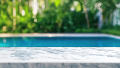Fototapeta premium Empty white marble table top with clear blue swimming pool and lush green tropical foliage in background, copy space