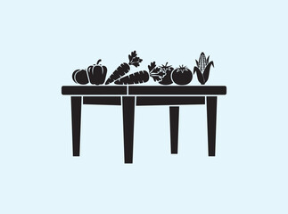 Solid black dining table silhouette with fruit and vegetable basket
