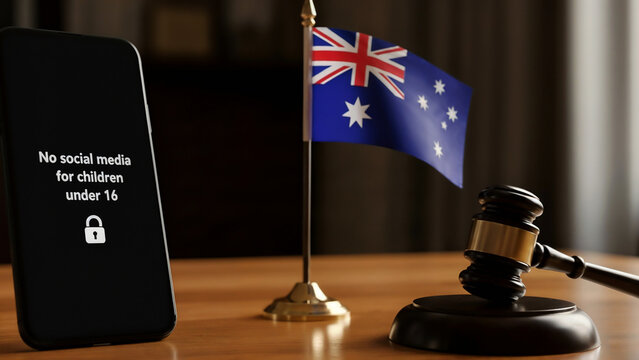 Smartphone, Australian flag and gavel &ndash; symbol of legislative action banning social media for children under 16