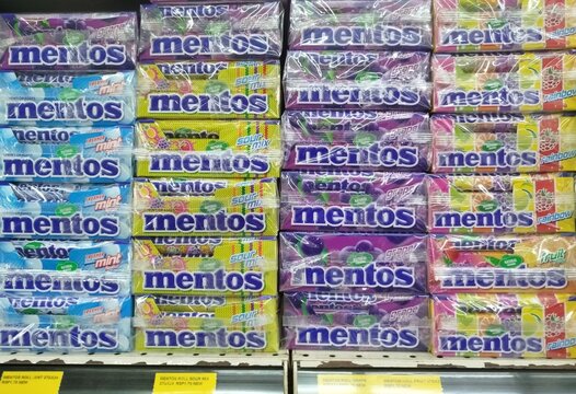 KUALA TERENGGANU, MALAYSIA- JANUARY. 6. 2026.. Mentos brand of mint candy is displayed on a store shelf, produced by Perfetti Van Melle Corporation, colorful retail packaging.