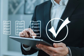 Businessman checking off tasks on a digital checklist on a tablet with a checkmark